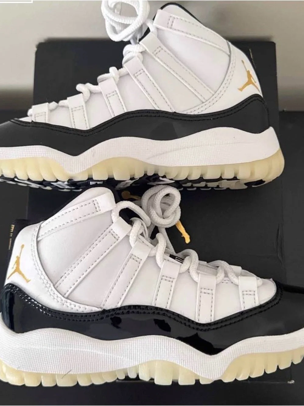 Jordan Kids Retro 11 Sneakers in White, Black & Gold